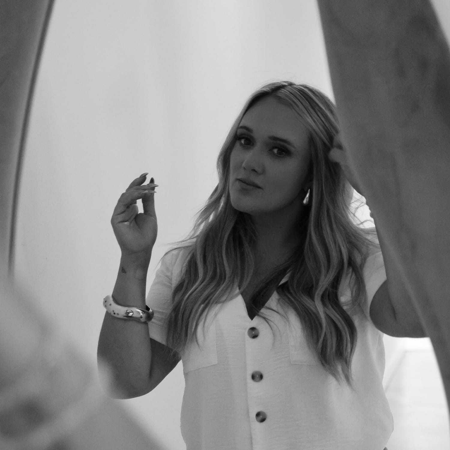 Portrait of Alyse, a professional stylist at Stella Beauty, showcasing their expertise and style.