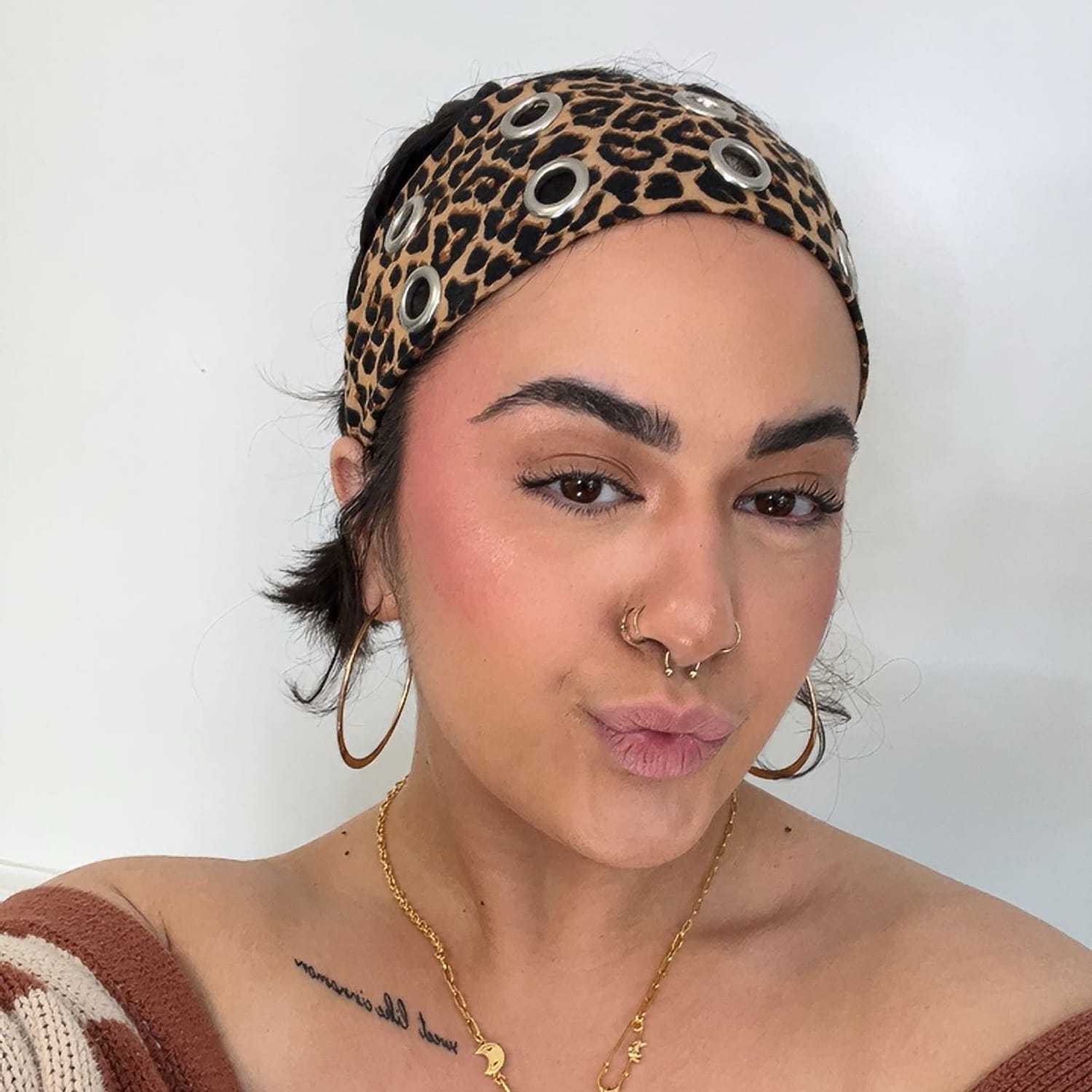 Portrait of Mailee, a professional stylist at Stella Beauty, showcasing their expertise and style.