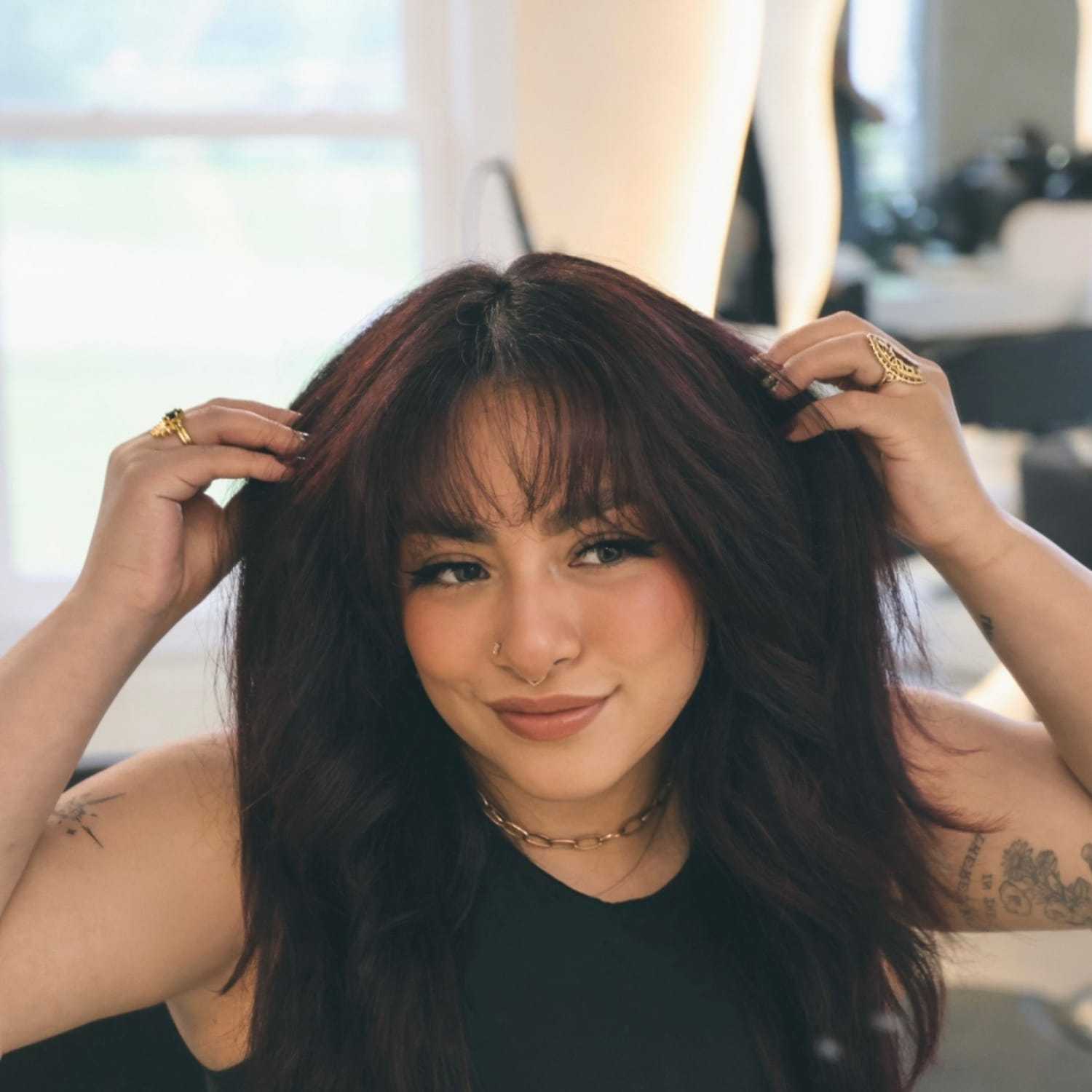 Portrait of Giselle, a professional stylist at Stella Beauty, showcasing their expertise and style.