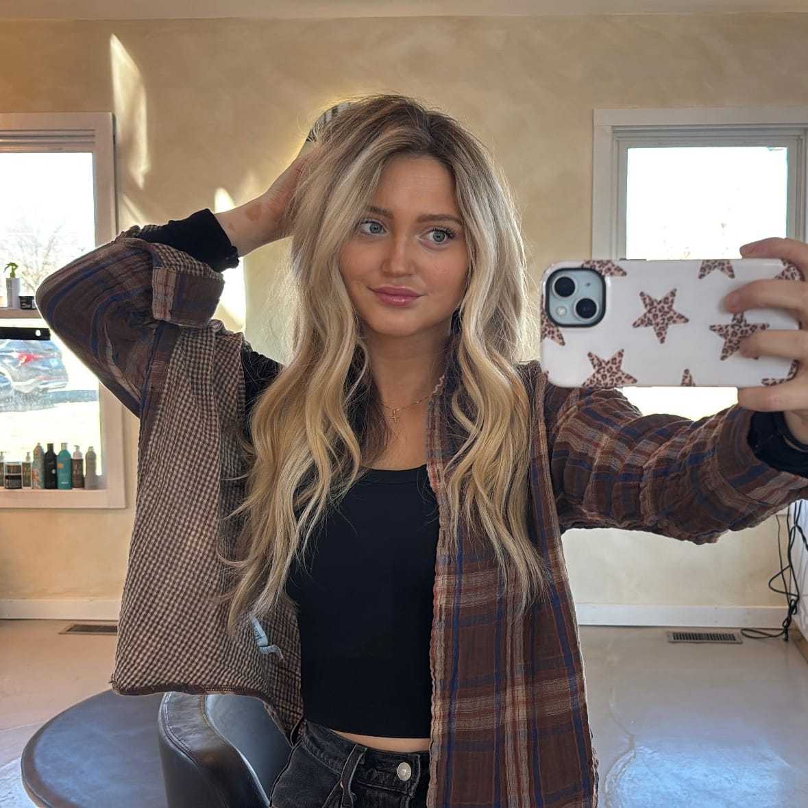 Portrait of Ella, a professional stylist at Stella Beauty, showcasing their expertise and style.